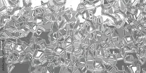 Abstract monochromatic background with a crystalline or geometric pattern of interlocking shapes and sharp edges, rendered in shades of gray and white with a metallic sheen