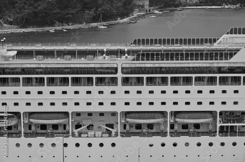 Italian family cruiseship cruise ship liner Lirica, Armonia or Sinfonia in port of Dubrovnik, Croatia during Summer Mediterranean cruising with harbor infrastructure marine traffic