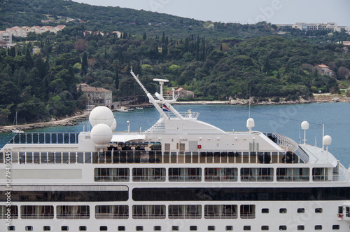 Italian family cruiseship cruise ship liner Lirica, Armonia or Sinfonia in port of Dubrovnik, Croatia during Summer Mediterranean cruising with harbor infrastructure marine traffic
