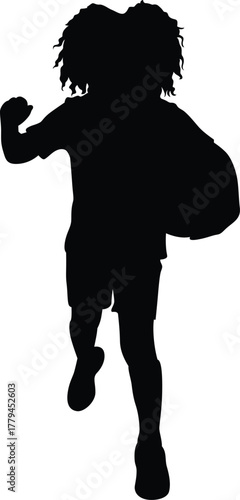 Silhouette of a young child with wild hair running forward holding a large object