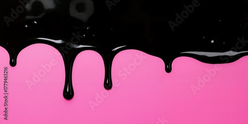 a black and pink liquid dripping down a wall