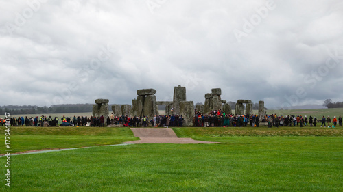 Crowd Gathering at Stonehenge on Cloudy Day