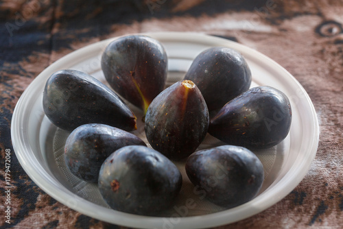 Ripe black figs in a pla