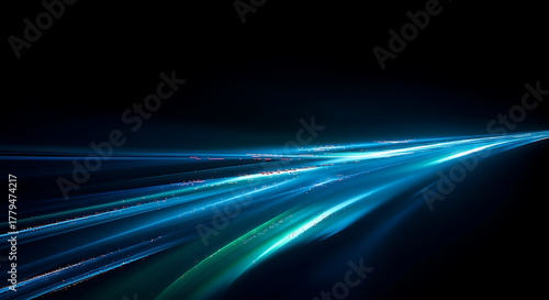 Abstract blue light streaks representing speed, technology, and futuristic energy flow on a dark background