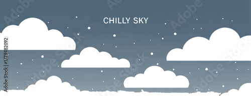 Winter sky with fluffy clouds and falling snow creating a chilly atmosphere