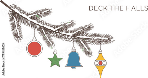 Holiday ornaments hanging from a snow covered pine branch for christmas time