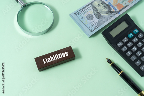 Business concept with a text Liabilities on wooden block