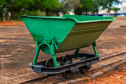 Iron coffee cart once used on narrow-gauge farm tracks to move dried beans from yards to storage barns, speeding transport during Brazil’s coffee boom era in the early 20th century