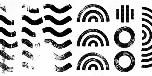 Collection of black abstract brush stroke shapes and graphic elements on a white background