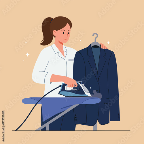 A person in a white coat irons a blue jacket on an ironing board with steam. A hanger holds the jacket