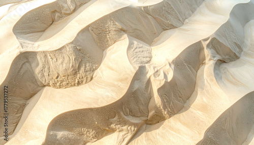 Wallpaper Mural Aerial view of rippling sand dunes, illuminated by sunlight. Shadows create dramatic contrast Torontodigital.ca