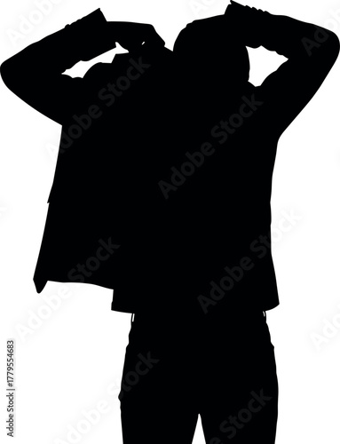 Dark silhouette of an anonymous man getting dressed, putting on or taking off his jacket isolated on a white background