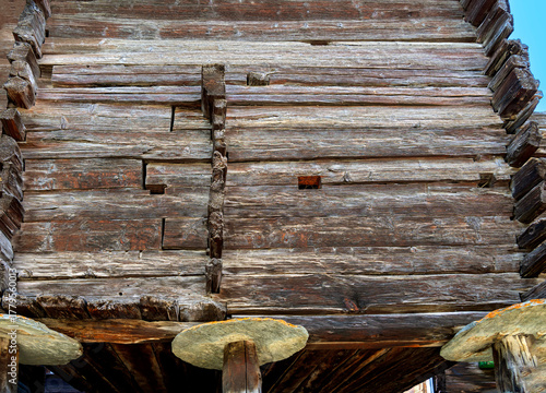 Old barn made of wooden blocks on stone slabs for storing supplies to protect against mice in Zermatt in the canton of Valais, Switzerland