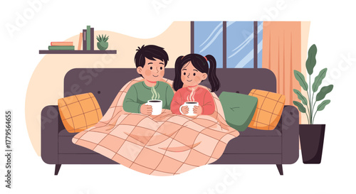 Two happy children cozy up on a sofa under a blanket, enjoying hot drinks in a warm living room.
