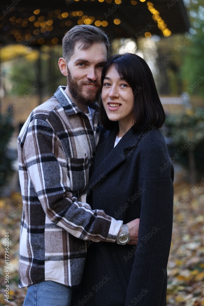 Fototapeta premium Happy couple hugging in autumn park. Romantic relationship