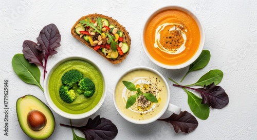 Wallpaper Mural Culinary Kaleidoscope: A vibrant spread of healthy food items, including a slice of bread and various types of delicious soup with fresh greenery, offers a feast for the eyes and the palate. Torontodigital.ca