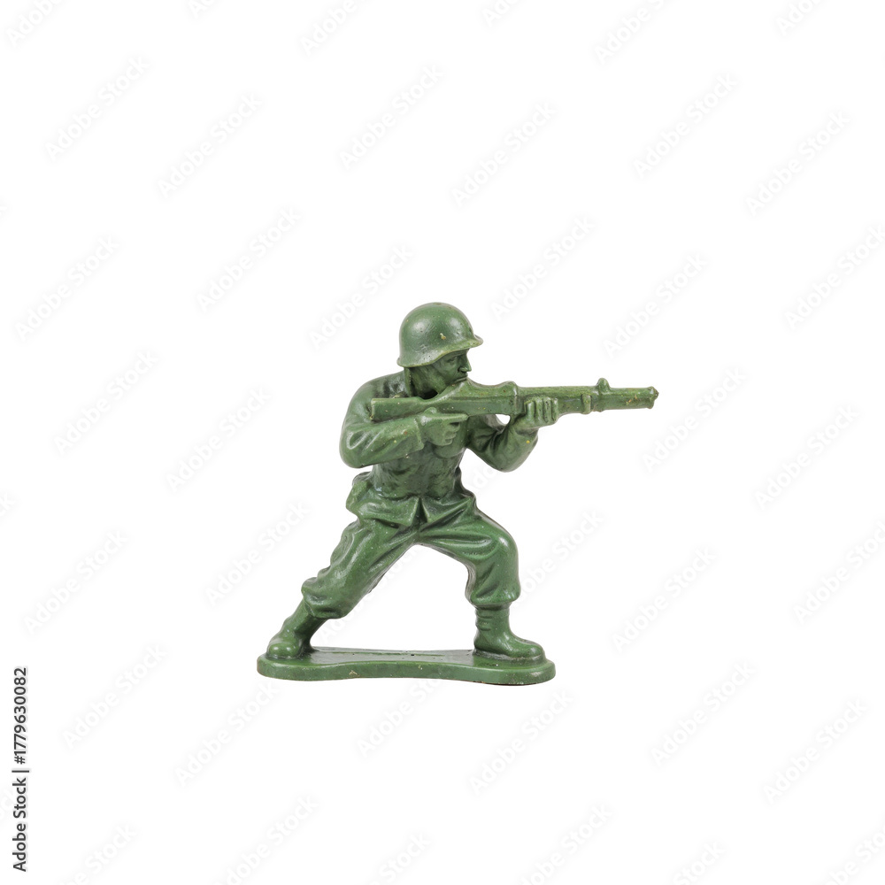 Obraz premium Isolated green plastic toy soldier aiming a rifle against the solid contrasting background
