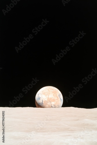 A planet rises above a barren, textured surface against a dark expanse, highlighting the vastness of space exploration and celestial events.