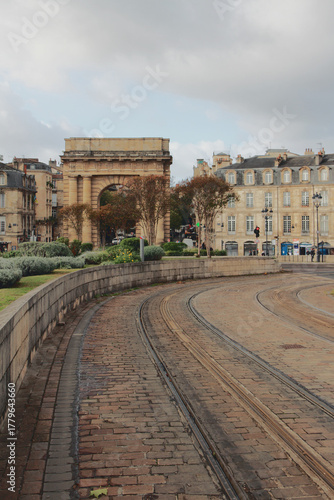 Tram tracks in cobblestone pavement. Bordeaux, France