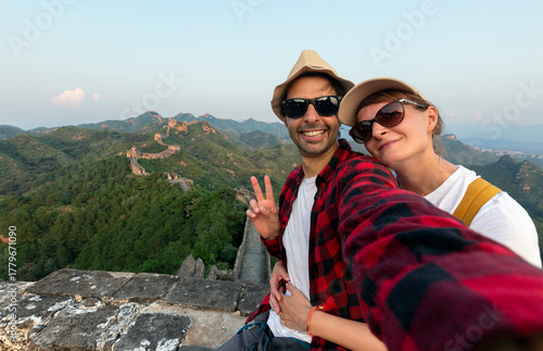 Photography Happy couple tourists taking selfie picture at Great wall of China, top worldwide tourist destination