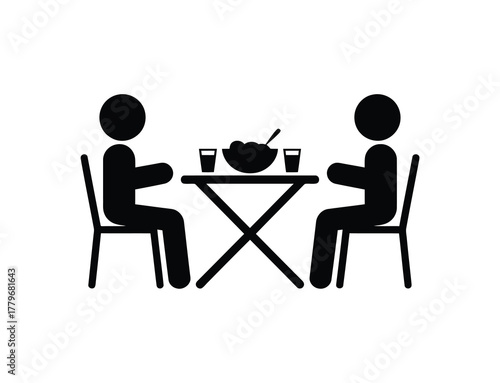Black Icon of Two People Dining Together at Table with Food and Drinks