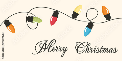 Kartka świąteczna z napisem Merry Christmas i z sznurem kolorowych lampek choinkowych.