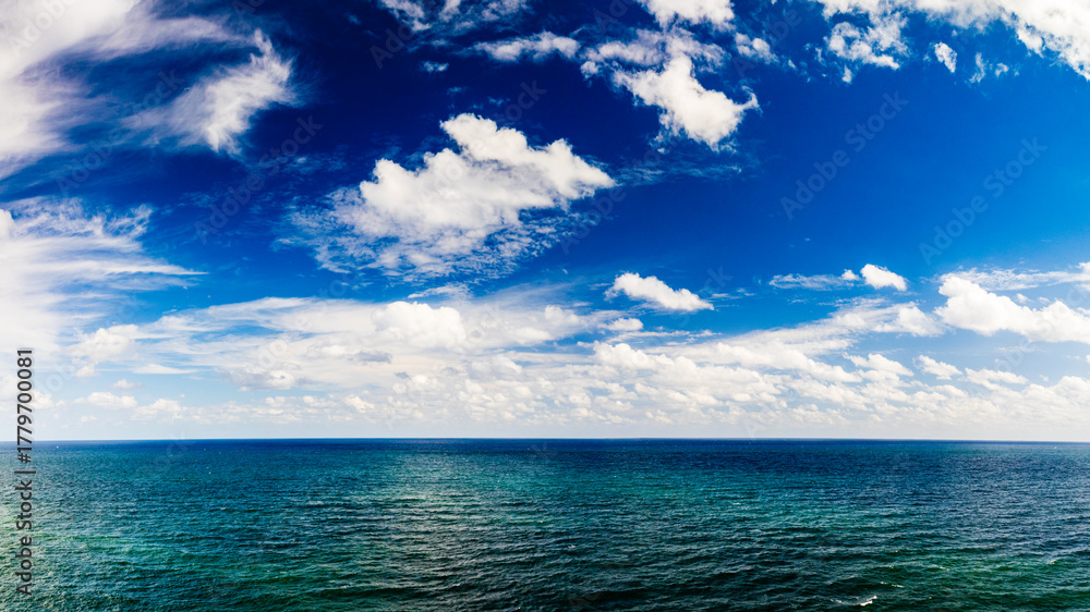 Fototapeta premium panoramic drone view of clouds over ocean