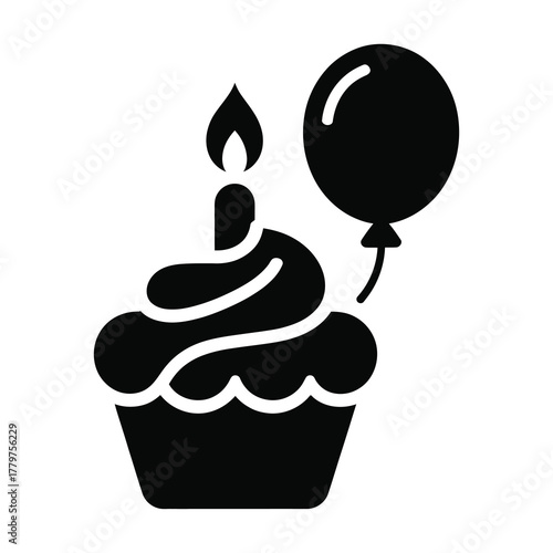 Birthday cupcake with candle and balloon silhouette
