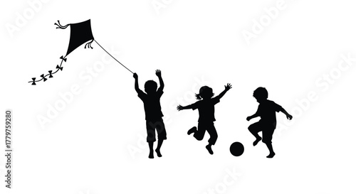 Children playing with a kite and a ball in silhouette