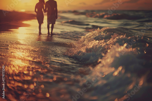 Romantic seaside walk with a couple at sunset surrounded by golden hues and soft waves