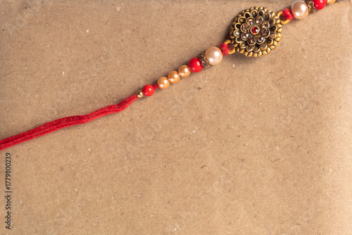 Elegant Rakhi bangle with red thread and beads for Indian festival
