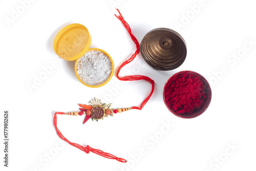 Rakhi festival decoration, powder boxes, red thread, beads and handmade pendant ornament, colorful festival.