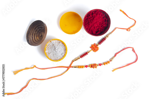 Festive rakhi thread with colored powders for Raksha Bandhan celebration