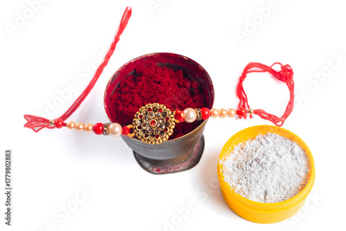 Traditional Rakhi decoration with ritual ornaments for Raksha Bandhan.