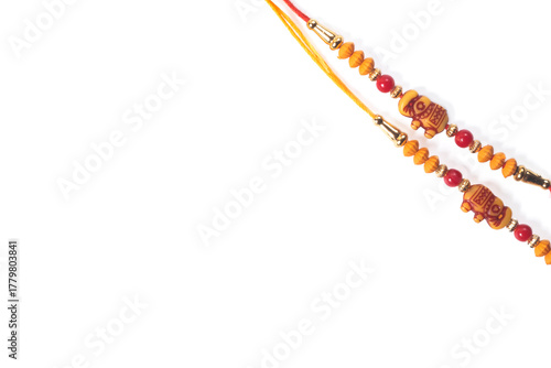 Colorful Rakhi bangle made of red and orange beads for Raksha Bandhan celebration