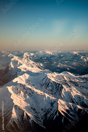 Aerial view of snowy mountains from an airplane