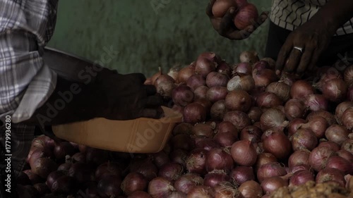 Handling Onions in a Market - A Close-up Look
