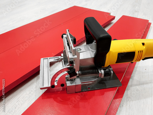 Biscuit joiner waiting for working in furniture production.