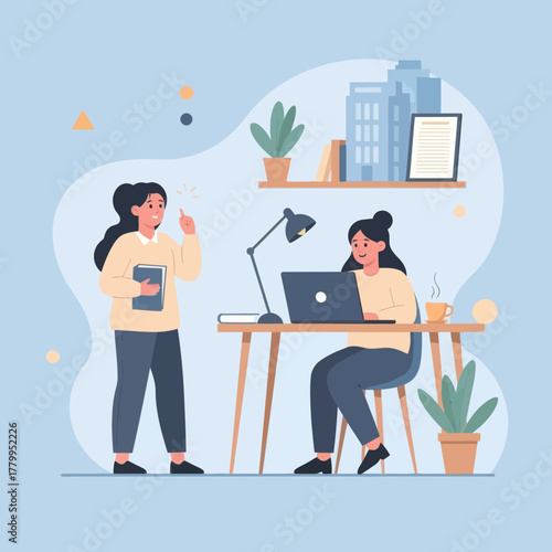 Two Women in a Workspace One Standing with a Book One Working on a Laptop.