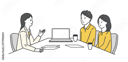 窓口でお客様の接客をするビジネスパーソン