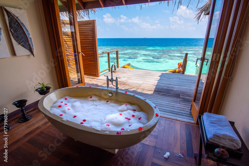 Fototapeta Naklejka Na Ścianę i Meble -  Charming bath tube in the bungalow. Tropical island beach landscape exotic shore coast. Summer vacation, holiday amazing nature. Relax paradise, Maldives.