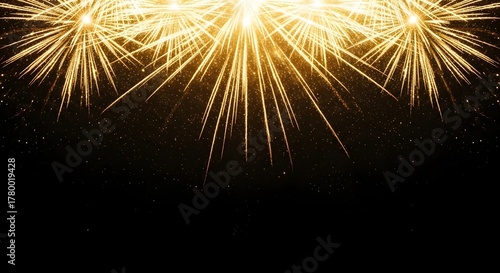 Golden fireworks bursting in the night sky celebration