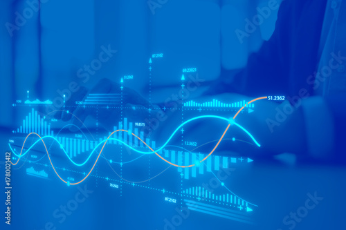 investment financial concept Business finance data analytics graph. Advisor using KPI Dashboard on virtual screen, man using computer laptop working with data charts with blue background