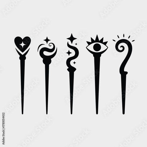 Five stylized magic wands with mystical symbols heart stars