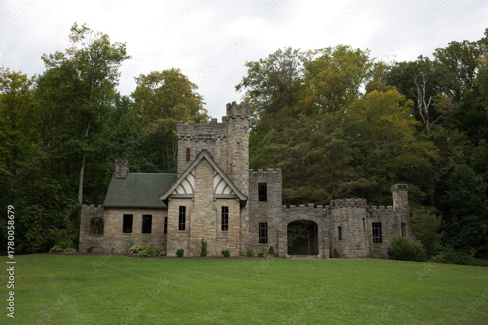 Fototapeta premium Stone Folly or Castle Ruins in Lush Green Forest Setting