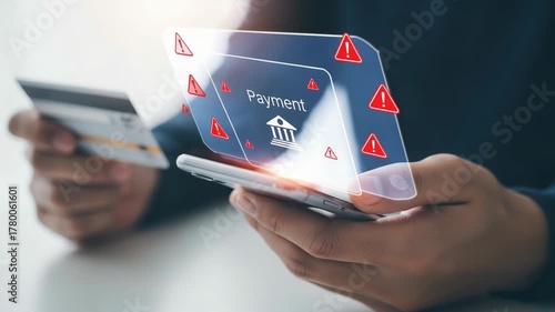 Person holding phone with payment screen and credit card with alerts