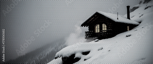 A charming wooden cottage nestled in a snowy forest landscape, ready for the winter season.