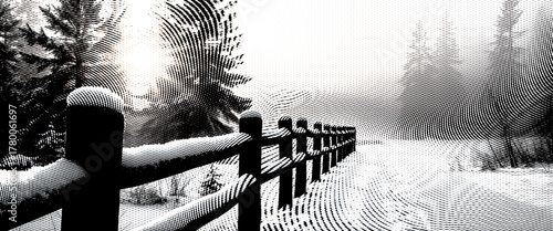 Black and white photo of a man on a swing in a snowy, frozen winter landscape with trees and a fence.