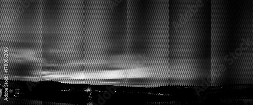 Black dark storm clouds time lapse over the city at orange sunset.