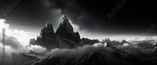 The high alpine peak and snowy winter landscape reveal a beautiful misty morning view.